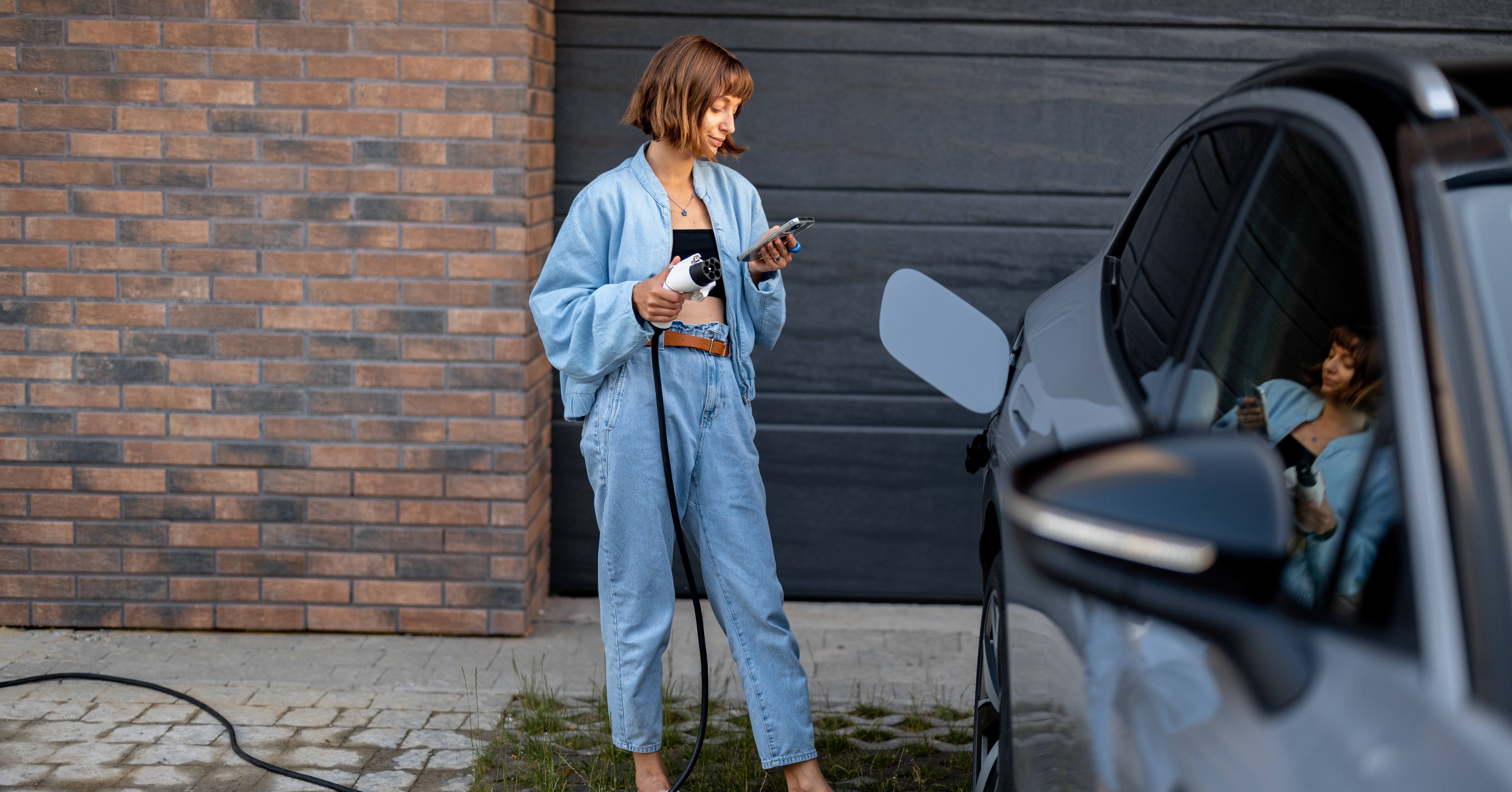 Woman charging EV